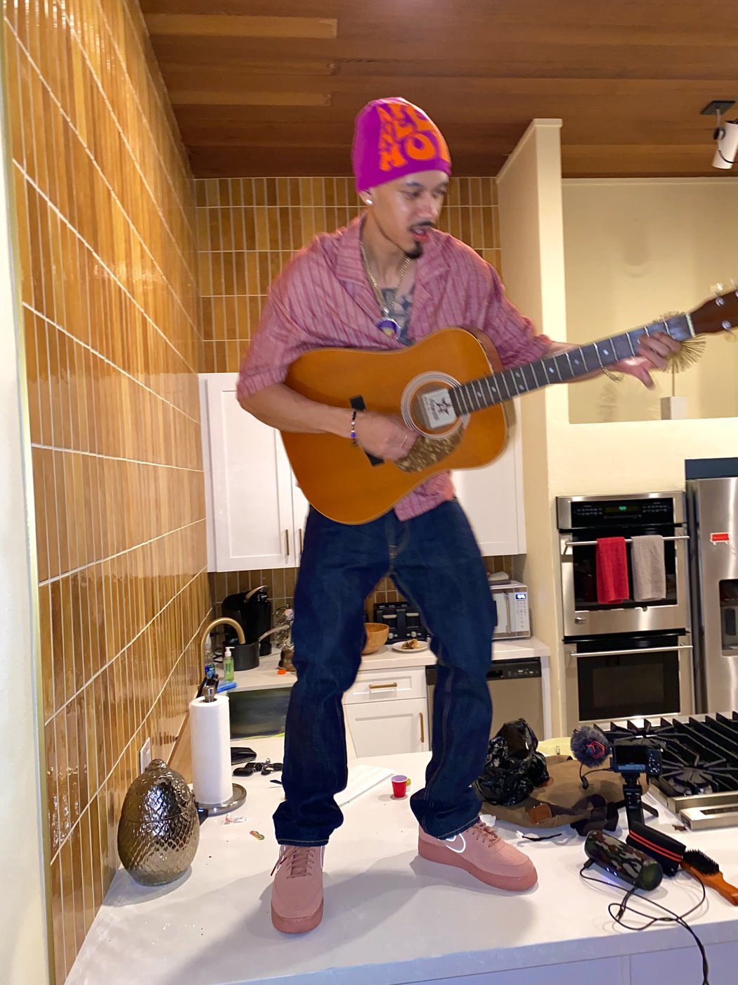 Baby Man playing guitar